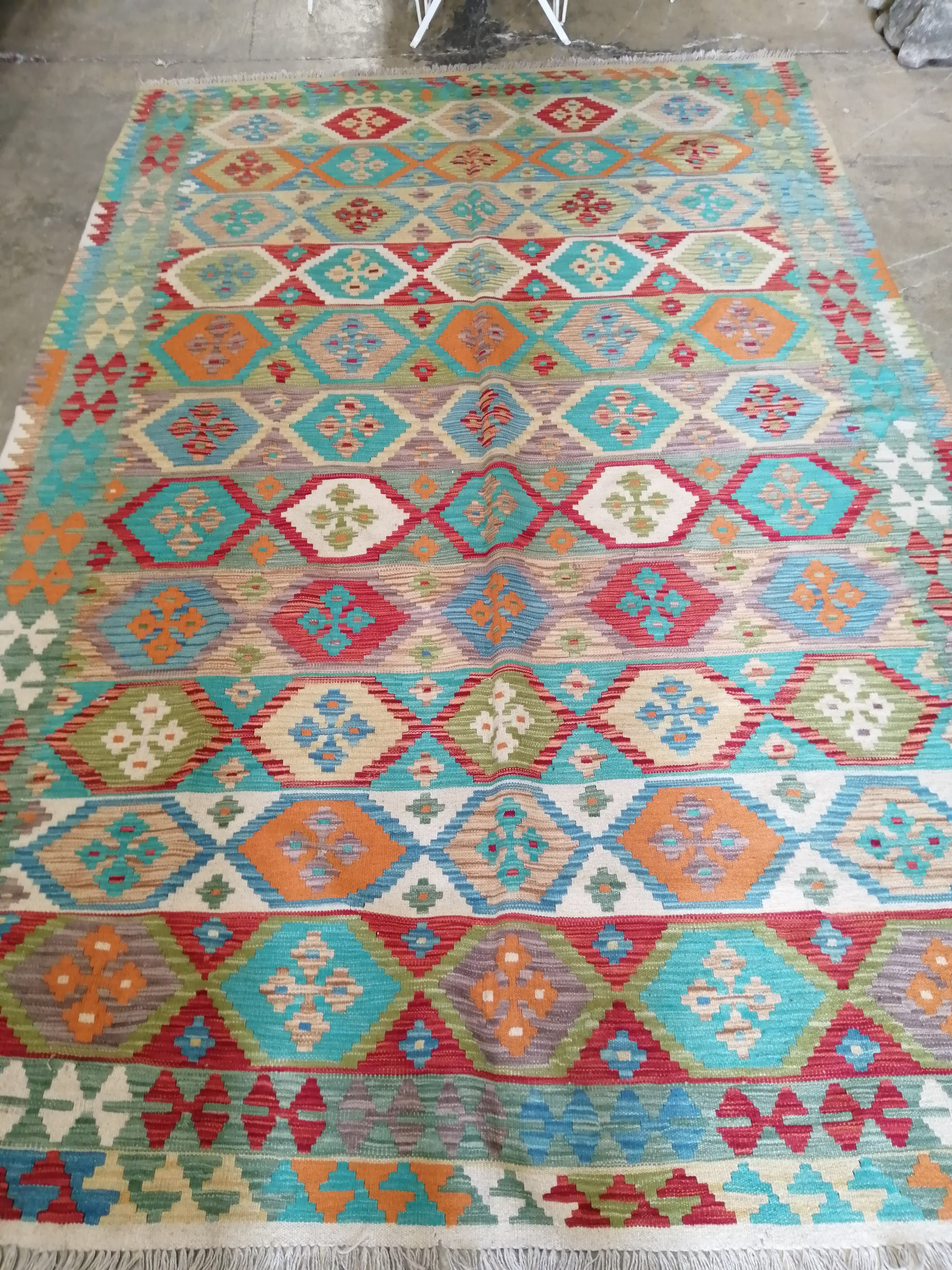 An Anatolian style polychrome Kilim carpet, 312 x 202cm